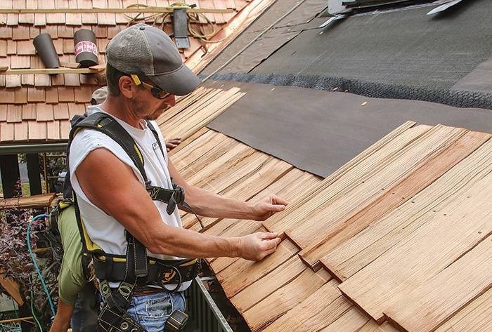 our roofer completing a cedar roof replacement in Westwood