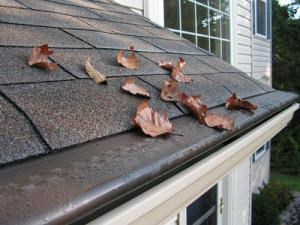 clogged gutter risks|downspout ice image|roofing in Arlington, MA|Old Gutters Aluminum|Copper Gutters|clogged gutters|Top 4 Dangers of Clogged Gutters
